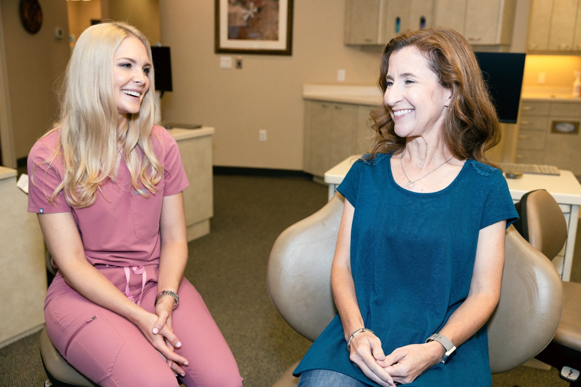 Greatwood Orthodontics Invisalign Consultation Orthodontist reviewing Invisalign treatment options during a Greatwood orthodontics consultation.